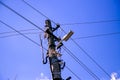 High voltage electric pole and transmission lines with clear blue sky. Electricity pylons. Power and energy engineering system. Da Royalty Free Stock Photo