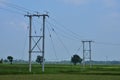 High voltage electric pole and transmission lines with clear blue sky. Electricity pylons Royalty Free Stock Photo