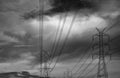 High voltage electric pole and transmission lines. Electricity pylons with dark sky and clouds. Power and energy. Energy Royalty Free Stock Photo