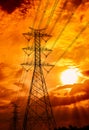 High voltage electric pole and transmission lines. Electricity pylons at sunset. Power and energy. Energy conservation. High Royalty Free Stock Photo