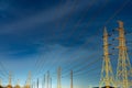 High voltage electric pole and transmission lines in the evening. Electricity pylons at night. Power and energy. Energy Royalty Free Stock Photo