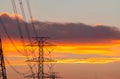 High voltage electric pole and transmission lines in the evening. Electricity pylons at sunset. Power and energy. Energy Royalty Free Stock Photo