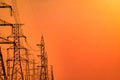 High voltage electric pole and transmission lines in the evening. Electricity pylons at sunset. Power and energy. Energy Royalty Free Stock Photo