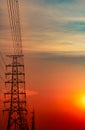 High voltage electric pole and transmission lines in the evening. Electricity pylons at sunset. Power and energy. Energy Royalty Free Stock Photo