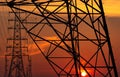 High voltage electric pole and transmission lines in the evening. Electricity pylons at sunset. Power and energy. Energy Royalty Free Stock Photo