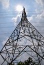 High voltage electric poles in the city of Bangkok, Thailand, The sun shines over the top of the high voltage pole, Metropolitan Royalty Free Stock Photo