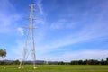 Photograph of a high voltage pole on a sky background.