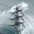 High voltage Electric power line against cloudy sky Royalty Free Stock Photo