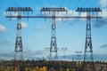 high voltage electric pylon and electrical wire with blue sky. Big Electricity poles. Power and energy concept Royalty Free Stock Photo