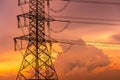 High voltage electric pylon and electrical wire with sunset sky. Electricity pole. Power and energy concept. High voltage grid Royalty Free Stock Photo