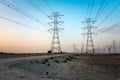 High Voltage an electric tower in sunset time near Al Hofuf Desert - Saudi Arabia Royalty Free Stock Photo