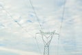High voltage electric transmission pylon silhouetted. Electricity transmission pylon silhouetted against blue sky. High voltage Royalty Free Stock Photo