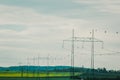 High voltage electric transmission pylon silhouetted. Electricity transmission pylon silhouetted against blue sky. High voltage Royalty Free Stock Photo