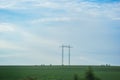 High voltage electric transmission pylon silhouetted. Electricity transmission pylon silhouetted against blue sky. High voltage Royalty Free Stock Photo