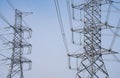 High voltage electric transmission tower. High voltage power lines against the sky. Electricity pylon and electric power Royalty Free Stock Photo