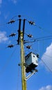 High voltage electrical power cables and transformer seen erected on a wooden pole. Royalty Free Stock Photo