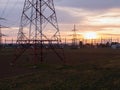 High voltage electrical substation switchyard in rural area during sunset Royalty Free Stock Photo