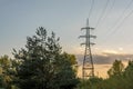 High voltage electrical support. Clear blue sky with cumulus clouds in the background. The energy industry. The current goes Royalty Free Stock Photo