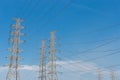 High voltage electrical tower blue sky background. Royalty Free Stock Photo