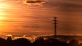 High voltage electrical tower at gold sunset background. Royalty Free Stock Photo
