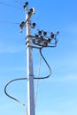 High Voltage Electricity Pillars Cables On Electricity Power Tower On Blue Sky Background. Transmission Lines. Royalty Free Stock Photo