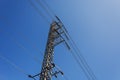 High voltage electricity pole and blue sky. Royalty Free Stock Photo