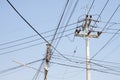 High voltage electricity pole in blue sky background Royalty Free Stock Photo