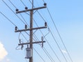 High voltage electricity pole with blue sky background Royalty Free Stock Photo