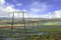 High-voltage electricity poles and power lines in the midst of nature in Iceland Royalty Free Stock Photo