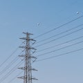 High voltage electricity post on blue sky background Royalty Free Stock Photo