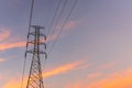 High voltage electricity post in colorful sunset sky background Royalty Free Stock Photo