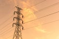 High voltage electricity post in colorful sunset sky background Royalty Free Stock Photo