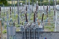 High voltage electricity power distribution plant and electricity pillars with ceramic insulator and a lot of cables Royalty Free Stock Photo