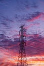 High voltage electricity pylon pole with sky and cloud colorful sunset Royalty Free Stock Photo