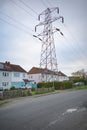 High voltage electricity pylon right outside residential homes. Surrey, England.