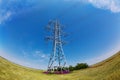 High-voltage electricity pylons against blue sky Royalty Free Stock Photo