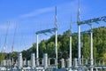 High voltage electricity pylons against perfect blue sky with white clouds. electric poles Royalty Free Stock Photo