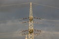 high-voltage electricity pylons against rain clouds Royalty Free Stock Photo