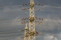 high-voltage electricity pylons against rain clouds Royalty Free Stock Photo
