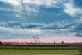 Power line in cultivated fields Royalty Free Stock Photo