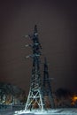 High-voltage electricity pylons and power lines at Night sky Royalty Free Stock Photo