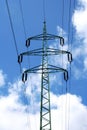 High voltage eletrical towers and lines with blue sky and clouds. Eletricity towers with blue sky background. Transmission lines. Royalty Free Stock Photo