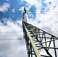 High voltage eletrical towers and lines with blue sky and clouds. Eletricity towers with blue sky background. Royalty Free Stock Photo