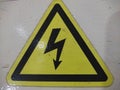 High Voltage Hazard Warning Sign - Yellow Triangle with Black Lightning Bolt Royalty Free Stock Photo