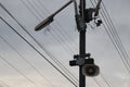 A high-voltage light pole fitted with a lamp and a speaker cabinet to announce or amplify the sky background and selectable focus.