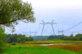 High voltage line on the background of a green landscape Royalty Free Stock Photo