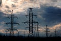 High-voltage line and a pole against the background of an overcast sky and the upcoming storm and weather. Royalty Free Stock Photo