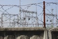 High-voltage lines against the background of electrical distribution stations at sunrise. Royalty Free Stock Photo