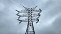 High voltage pillar, high voltage tower on the sky background. High-voltage power transmission lines, power distribution Royalty Free Stock Photo