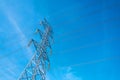 High voltage pole with blue sky background, Electric transmission line system for large industrial plants. Royalty Free Stock Photo